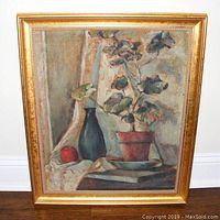Front view of the midcentury still life painting on canvas board in a gold frame.