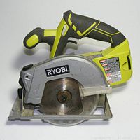 Side view of Ryobi P506 cordless circular saw showing blade and handle.