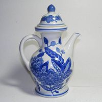 Front and side views showing the blue and white floral porcelain coffee pot, marked Formalities on bottom