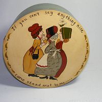 Top view showing lid artwork and quote on round tole painted wooden box