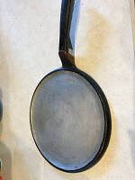 Photo of aluminum pancake skillet showing flat cooking surface and black handle