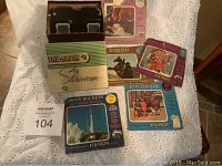 Full lot overview showing the View Master stereoscope box, the device, and five View Master reels with various themes.
