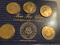 Six solid brass U.S. President commemorative coins mounted on a blue display card with presidential names and seal.
