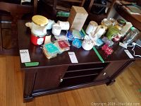 Top view of the TV stand with various items arranged on top, which are not included in the sale.