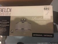Photo of the original box showing the Beldi Portland Collection semi-flushmount ceiling light with 2 lights, white shade and metal trim.