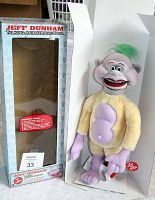 Full view of Jeff Dunham Peanut talking animatronic doll standing next to its original Jeff Dunham branded box.