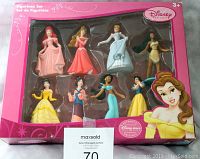 Front view of Disney Princess figurine set in original pink box packaging with eight figurines visible.