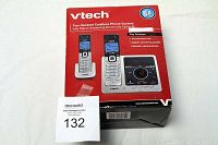 Box of VTech Two Handset Cordless Phone System with Digital Answering Device and Caller ID showing front and top view with product images and key features.
