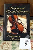 Cover photo of hardcover book titled '700 Years of Classical Treasures' with violin and sheet music image