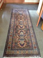 Full-length view of runner laid on tile floor showing overall pattern and condition