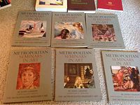 Six volumes of Metropolitan Seminars in Art by John Canaday laid out showing front covers with classic art paintings