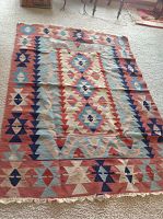 Full view of Kilim rug showing overall pattern and colors.