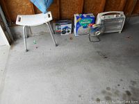 Full lot view including shower seat, drain cleaner, Vicks Vaporizer, Galaxy fan, and Marvin heater.