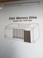 Black and white cover page of the manual showing the Disk Memory Drive Model PHP1250 with illustration