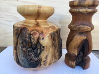 Photo displaying the wood vase and candlestick holder side by side showing natural wood grain, knots and charred textures