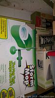 Boxed Storm Mop with bucket system features green and white packaging with text about mop keeping no dirt and extendable mop handle.