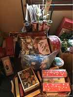 Large lot of holiday wrapping paper, gift boxes, bags, ribbons, bows and Christmas cards, mostly unopened or unused.