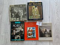 Five art books arranged side by side, showing covers of each.