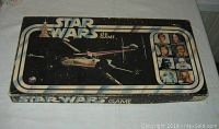 Photo of closed original Star Wars board game box with character images and Star Wars logo on lid.