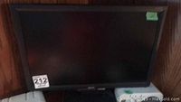 Acer 20 inch widescreen computer monitor with black bezel, powered off, photo taken to show the display unit in the lot.