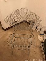 Front angle view of chrome wire chair with ottoman