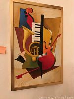 Framed original canvas painting showing abstract representation of piano keys, violin, and horn in warm colors.