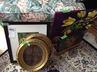 Five art pieces including two oil paintings one depicting yellow calla lilies, three framed prints including an oval gold-framed print and two other prints.
