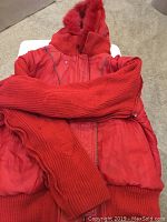 Red leather jacket with quilted reversible side and ribbed knit cuffs and hem