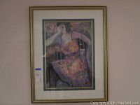 Full view of framed lithograph artwork showing the composition and colors of the flapper woman portrait.