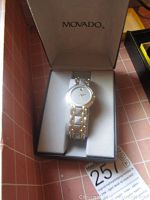 Front view of watch in original Movado box showing dial and branding