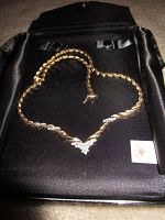 Necklace laid in original black box, full front view