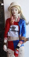 Front view of the Harley Quinn custom mannequin showing outfit, tattoos, and accessories