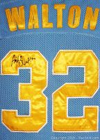 Close-up of Bill Walton autograph on gold satin number 32 on jersey back