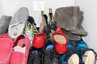 Lot of mixed men's and women's shoes, various styles and colors.