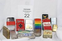 Front view of 14 assorted vintage lighters showing variety in brands, colors, and designs including Choppers, Zippo, Winston, Salem, Camel, and rainbow pattern lighter.