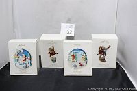 Four boxed Hallmark Keepsake Christmas ornaments from 2008 arranged in a row.