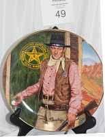 Front view of John Wayne Franklin Mint limited edition porcelain plate showing cowboy figure and background details.