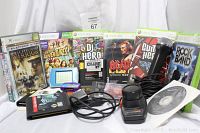Photo showing Xbox 360 game cases, Sega Genesis cartridges, microphone, handheld electronic games, and cables.