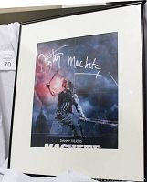 Framed and autographed poster of Danny Trejo as Machete with visible signature in silver marker.