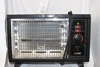 Front view of Climate Keeper electric heater showing metal grille, control panel with red ON/OFF switch, fan dial, thermostat dial, black casing, and power cord.