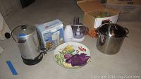 Mirro Magic coffee service, Hamilton Beach ice cream maker in box, decorative bowls, mugs, plates, painted serving dish, and roasting pot shown together
