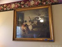 Framed print showing two women near a grand piano in a detailed vintage indoor scene with a twisted rope-style gold frame.