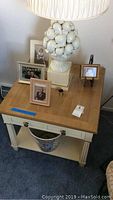 Square Henredon end table with drawer, showing wear on bottom shelf and used condition