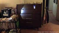 Full front view of four-drawer walnut dresser