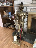 Full lot view showing brass knight statue behind and fireplace tool set in front
