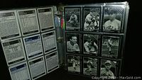 Photo of binder page with vintage black and white baseball cards, shown in plastic sleeves