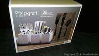 Box front showing Pfaltzgraff Everyday 36-piece silverware set with caddy and wooden tray, service for twelve.