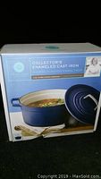 Front of the box showing blue casserole dish with lid and food inside.