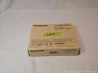 Front face of closed original box showing Panasonic branding and model CF-AA5713AM.