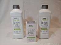 Front view of two 1-liter bottles of Amway Home Original Multipurpose Cleaner and one box of Amway Home Scouring Pads.